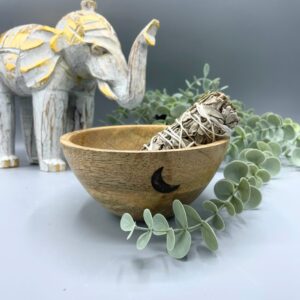 Wooden smudge bowl featuring three moons design, perfect for rituals and offerings.