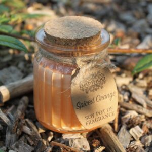 Spiced orange soy candle in a reusable glass jar with cork lid and twine label.
