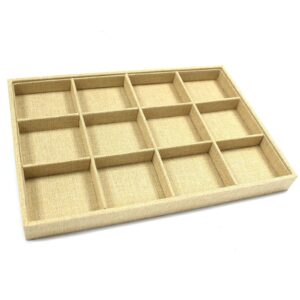 Twelve compartment jewellery display tray with natural rattan effect.