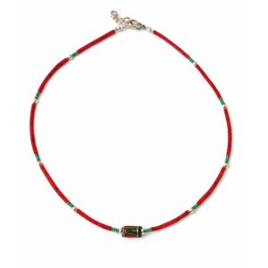 Handcrafted Nepalese necklace featuring vibrant coral beads and tribal accents.