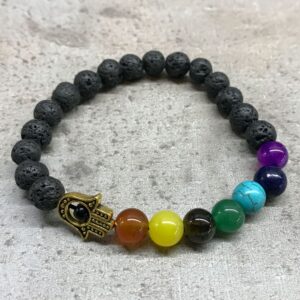 Lava stone bracelet featuring Hamsa design and various gemstones.