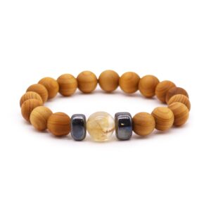 Cedarwood bangle with Citrine gemstone, symbolising personal power and positivity.