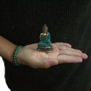 Brass Mini Hand Up Sitting Buddha ornament for home decor and relaxation.