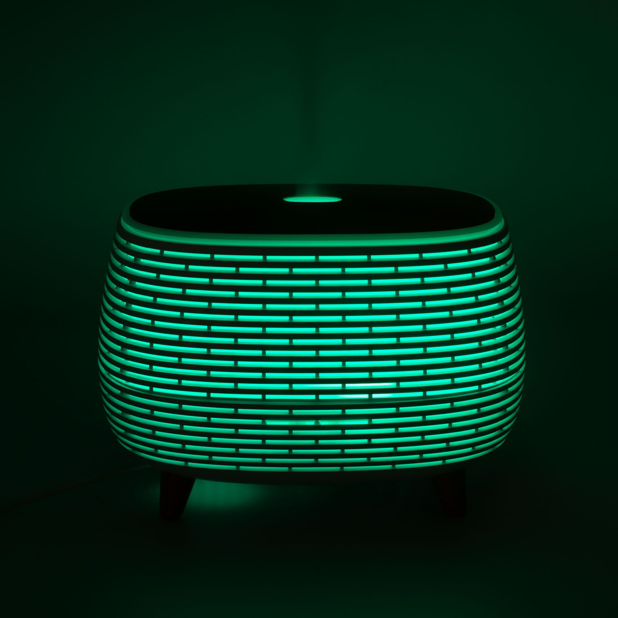 Futuristic ribbed aroma diffuser with wood-effect top and colour-changing light.