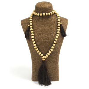 Handmade Bali tassel necklace with smooth wooden beads and colourful cords.