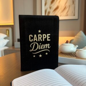 Elegant black velvet notebook with silver 'Carpe Diem' design on cover.