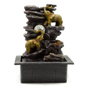 Elegant tabletop water feature with elephants, crystal ball, and water wheel.