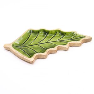 Elegant leaf-shaped wooden bowl with a glossy green enamel interior.
