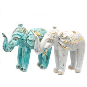 Hand carved wooden elephant in turquoise and gold, symbolising wisdom and strength.