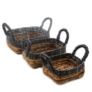 Set of three square baskets made from banana leaf and raffia.