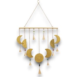 Brass moon phases chimes with intricate designs and bells for soothing sounds.