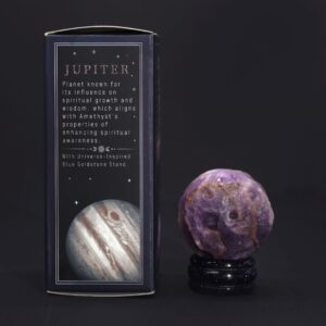Amethyst planet on a Solar Goldstone stand, showcasing its deep purple hue.