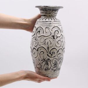 Cream swirls shaped vase, perfect for indoor plants and home decor.