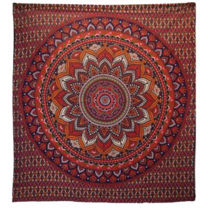 Vibrant orange and blue mandala bedspread that doubles as a wall hanging.