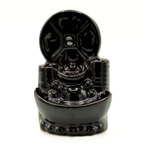 Intricately designed backflow incense burner with a Chinese coin motif.