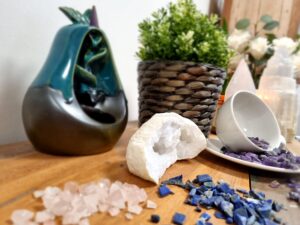 Bulk clear quartz gemstone chips in a natural setting for mindful living.