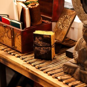Black leather notebook with embossed quote 'The Stories I Tell Myself'.