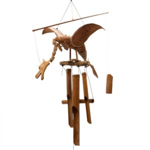 Handmade coconut dragon mobile with impressive wingspan for garden decor.