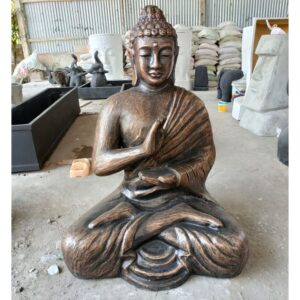 Large antique gold Buddha statue in a serene meditation pose.