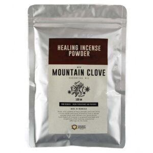 Mountain Clove incense powder in a decorative holder, ready for use.