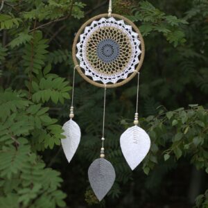 Large brown dream catcher handmade in Bali, featuring rattan and wooden beads.