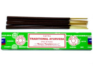 Hand-rolled Satya Incense sticks in vibrant packaging for a calming atmosphere.