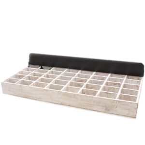 Whitewashed wooden tray with 40 compartments for home organisation.