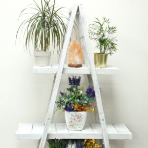 Folding wooden A-frame shelf in whitewash finish, perfect for home decor.