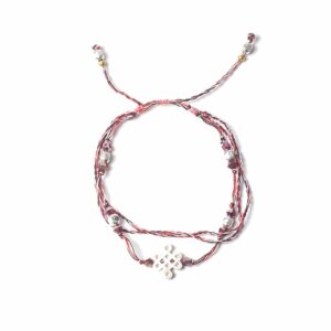 Temple String Bracelet featuring a symbolic silver charm and vibrant colours.