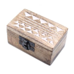 White washed wooden pill box with Aztec design, perfect for storage.