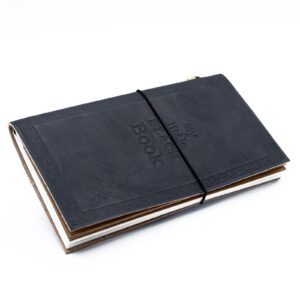 Elegant black handmade leather journal with embossed design and wrap-around band.