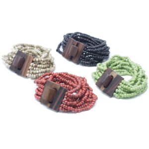 Assorted colours of a multi-bead bangle with a wooden clasp on a neutral background.