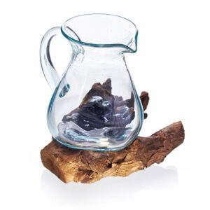 Handmade molten glass water jug on a wooden base, showcasing unique craftsmanship.