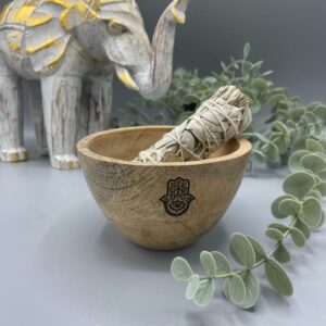 Wooden smudge bowl featuring Hamsa design, perfect for rituals and offerings.