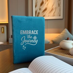 Light blue velvet notebook with embossed 'Embrace The Journey' message.