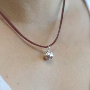 Silver Angel Bell with intricate design, symbolising faith and spirituality.