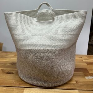 Beige cotton rope laundry basket, perfect for home storage solutions.