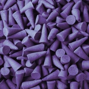 Violet incense cones arranged in a decorative display for calming ambiance.