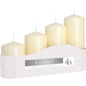 Set of four ivory pillar candles in varying heights for a calming ambiance.