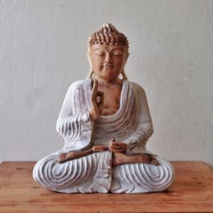 Elegant whitewashed Buddha statue perfect for home decor and meditation.