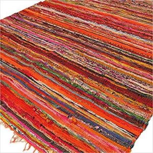 Vibrant orange luxury rag rug, perfect for adding warmth to any space.