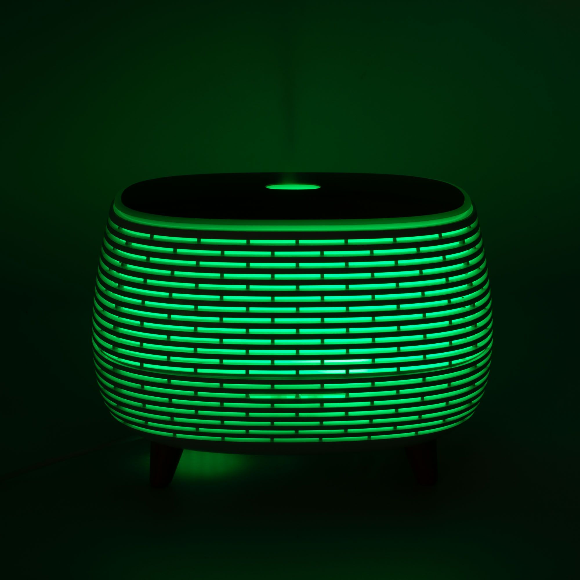 Futuristic ribbed aroma diffuser with wood-effect top and colour-changing light.