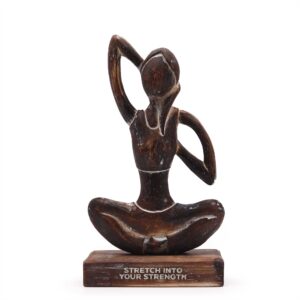 Antique wooden yoga lady figurine in cow face pose for mindful living.