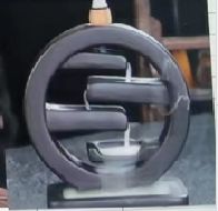 Elegant backflow incense burner in a Zen circle design for calming spaces.