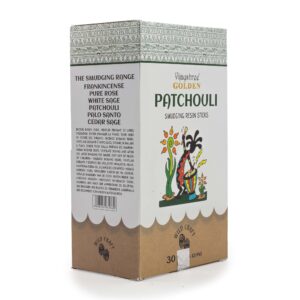 Golden Patchouli smudging resin sticks with a textured finish in a natural setting.