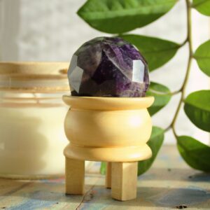 Rose Quartz Faceted Healing Ball with light brown stand for self-care and love rituals.
