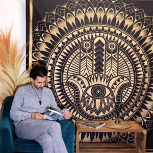 Elegant black and gold Hamsa design bedspread and wall hanging.