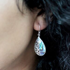 Handmade shell and silver earrings featuring a classic disc design.