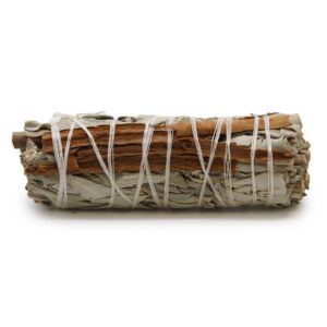 Smudge stick made with white sage and cinnamon for cleansing spaces.