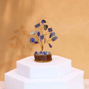 Mini gemstone tree featuring sodalite stones on a wooden base.